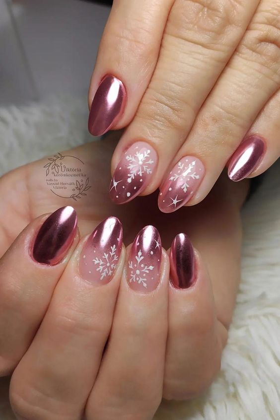  Shimmering Rose Gold Nails with Snowflake Accents
