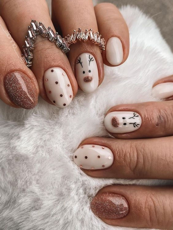 7. Festive Reindeer and Glitter Nail Art
